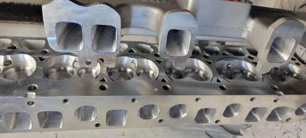newcomer racing edelbrock head port polich and clifford instake.webp
